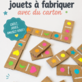 Enfant jouant avec un jouet en carton fait maison