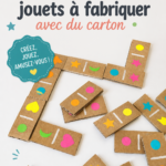 Enfant jouant avec un jouet en carton fait maison
